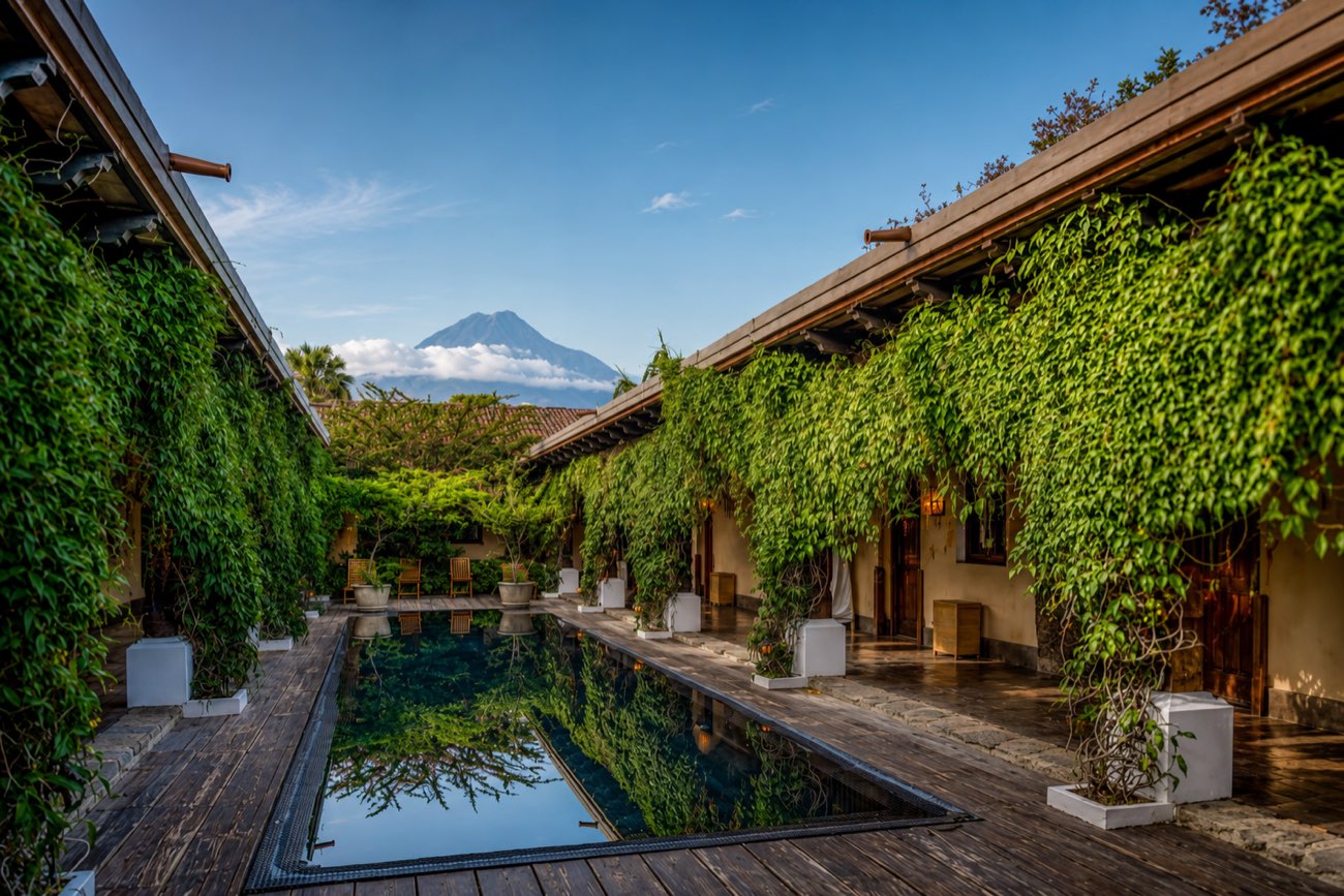 A courtyard in Antigua with the Agua Volcano beyond